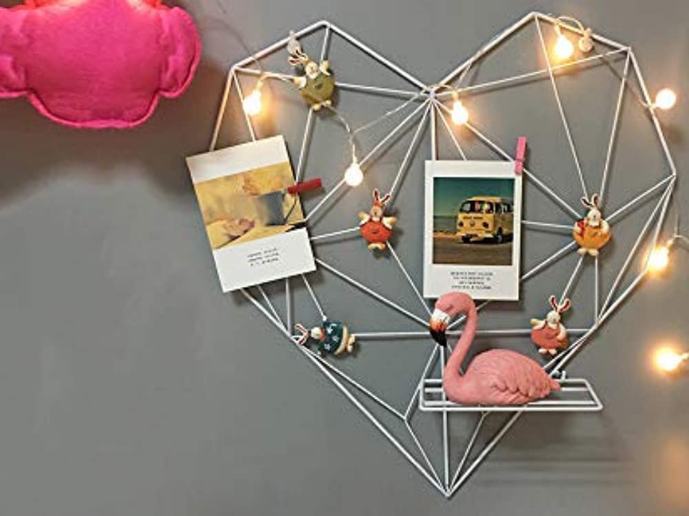 Heart frame styled with photographs