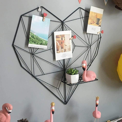 Black heart frame with photographs
